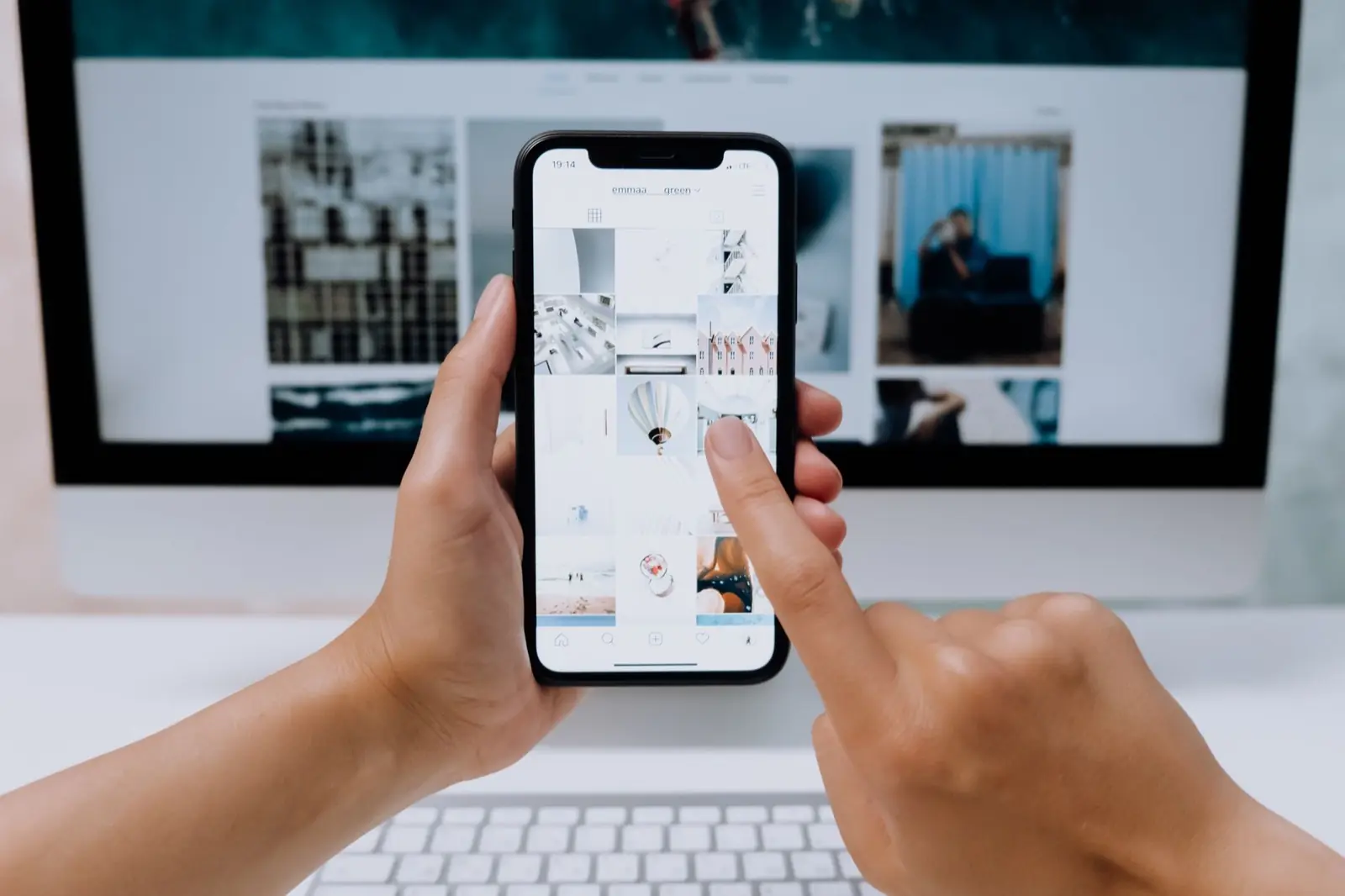 Hands holding a phone while a photo app is open